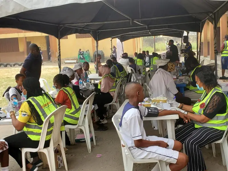 Students and staff under the outreach tents, Navy Town