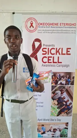 A student with his kit at our banner