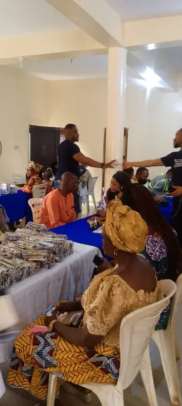 A volunteer checking blood pressure in Epe
