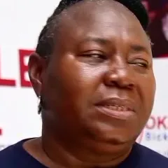 Mrs Erezi Joice Eterigho wearing a T-shirt printed with Okeoghene's face